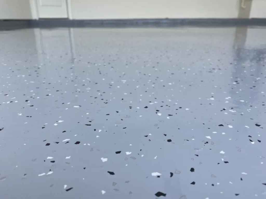 Close-up of an Econo epoxy garage floor in Albuquerque by 505 Garage Floors, an affordable single-color garage coating.