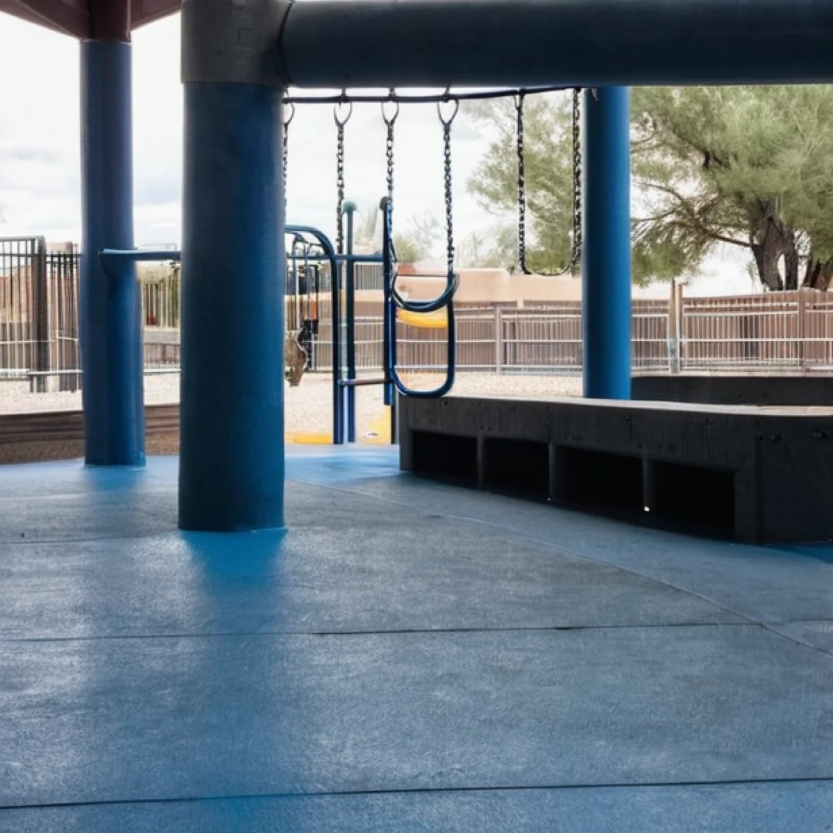 Sealed concrete overlay playground surface in Albuquerque by 505 Garage Floors, tough and weather-resistant for outdoor play areas.