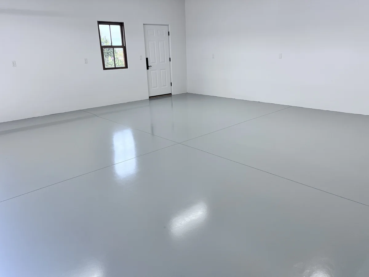 Charcoal flake epoxy garage floor with a high-gloss polyaspartic finish, completed by 505 Garage Floors in Albuquerque, NM