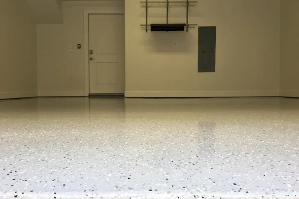 Econo tan epoxy garage floor in Albuquerque by 505 Garage Floors, a warm single-color coating that's an affordable way to upgrade a garage.